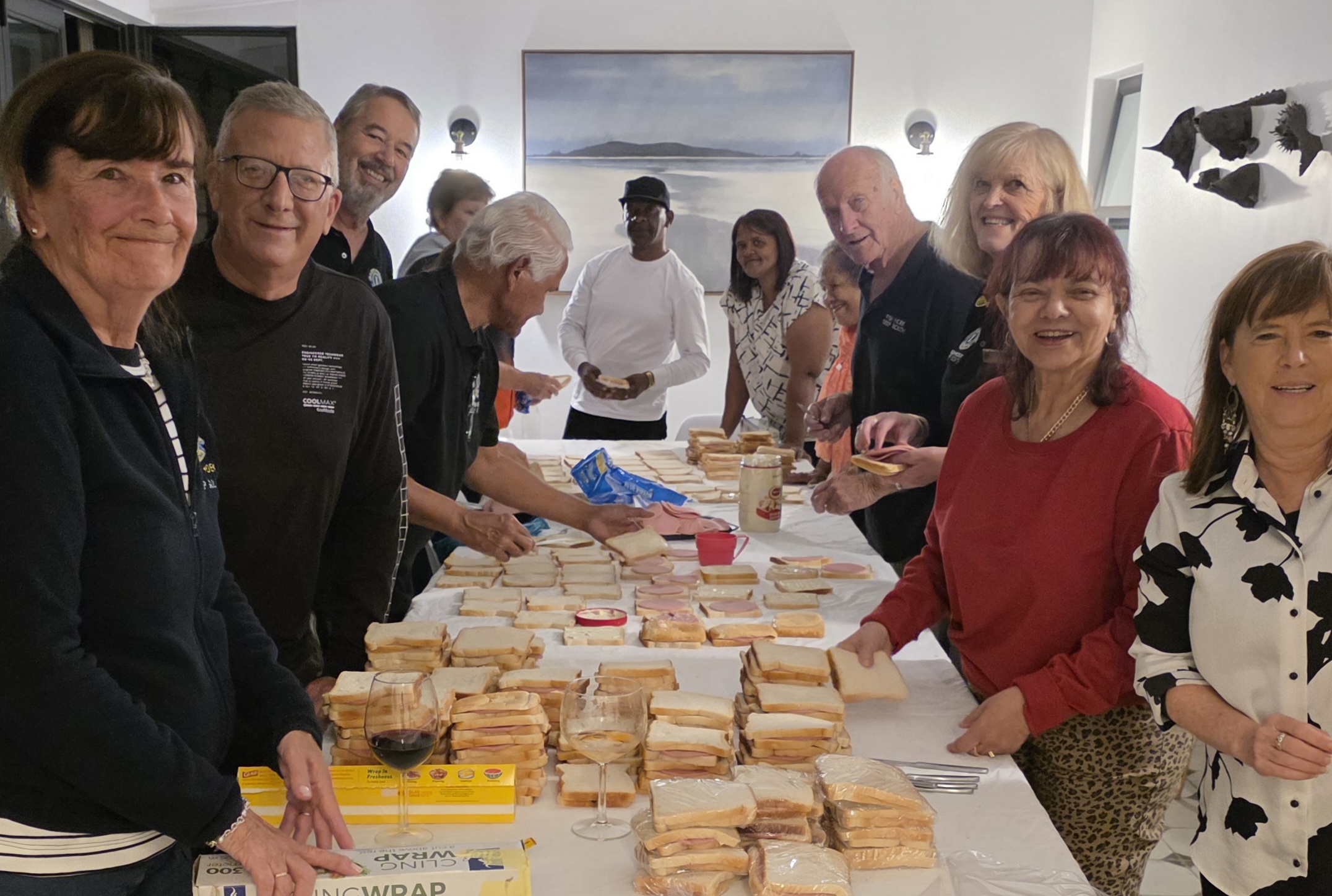 Lion Members making sandwiches for the hungry and ECDs